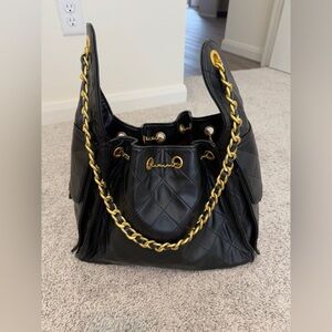 INSPIRED C medium handbag in black.